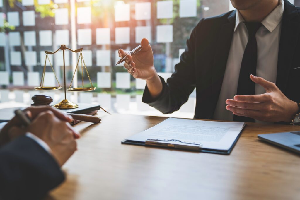 Millburn estate planning lawyer helping a client review legal documents.