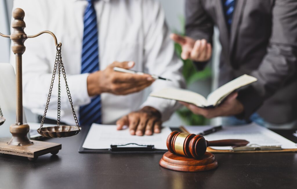 Scales of justice and globe representing offshore assets divorce and international property division.